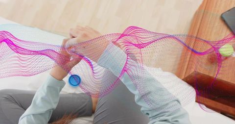 Woman Viewing Fitness Tracker with Smartphone in Bed Visualization