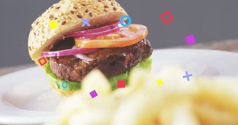 Gourmet Beef Burger with Sesame Seed Bun and Colorful Accents