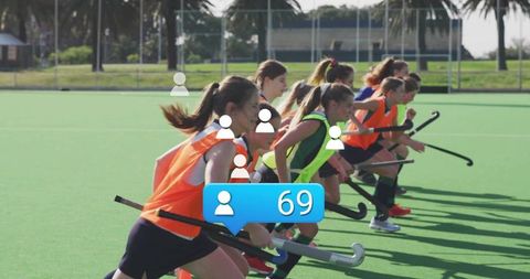 Female Field Hockey Players Training on Sunny Day