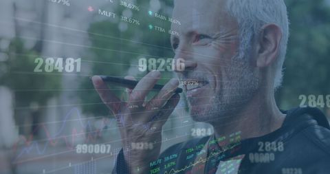 Man Engaging with Smartphone Amid High-Tech Data Display