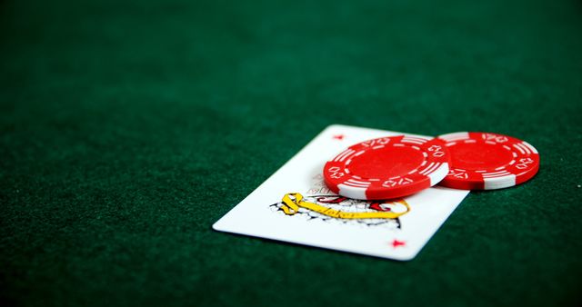 Playing card, dices and casino chips on poker table in casino