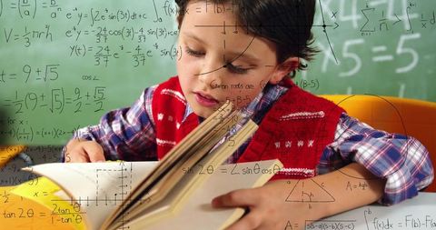 Focused boy learning math in classroom with overlay of formulas