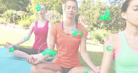 Group meditating women with central woman in orange top practicing outdoor yoga with wellness icons