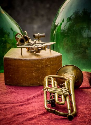 Vintage Musical Instruments and Telescope on Rustic Table