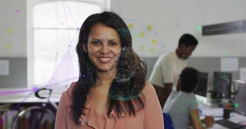 Smiling professional woman leading collaborative tech team with digital network overlay