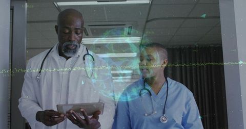 Senior doctor and nurse reviewing tablet with holographic globe and data visualization