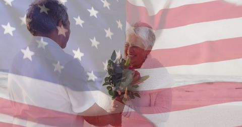 Senior Biracial Couple on Beach with USA Flag Overlay