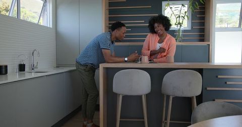 Young Couple Engaging at Modern Kitchen Counter