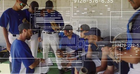 Baseball team huddling in dugout receiving coaching with digital hud analytics overlays