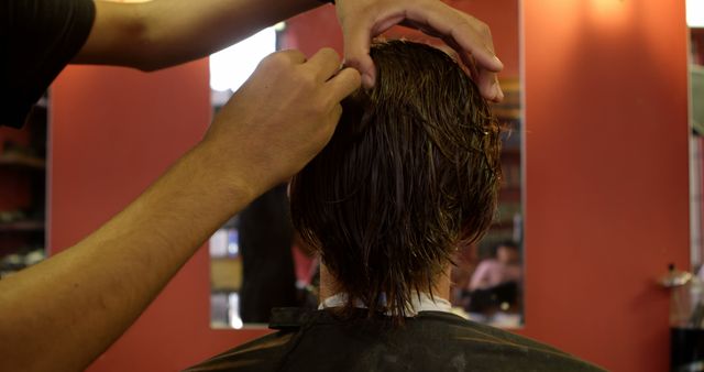 Caucasian man getting a haircut at a salon - Download Free Stock Photos Pikwizard.com