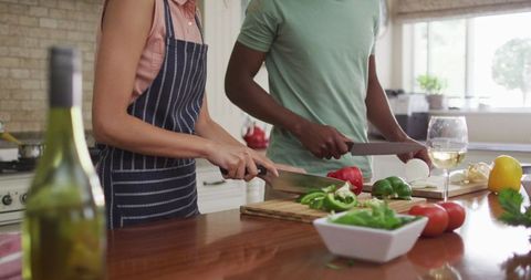 Couple Cooking Together, Cutting Fresh Vegetables in Modern Kitchen