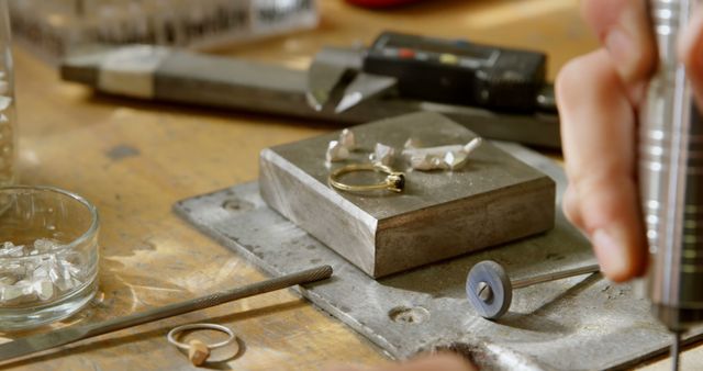 Craftsman Working on Jewelry at Workshop Bench - Download Free Stock Images Pikwizard.com