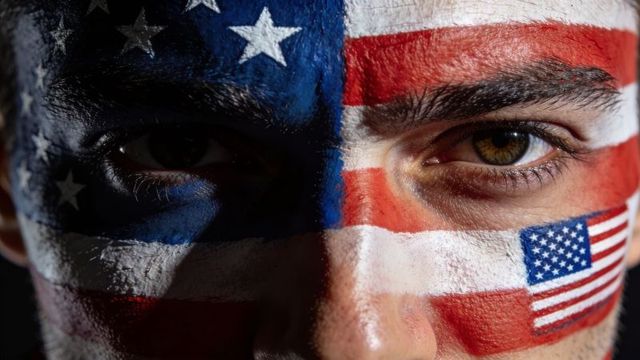 Bold american flag face paint close-up portrait with stars and stripes