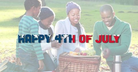 Family Celebrating Fourth of July Picnic in Park