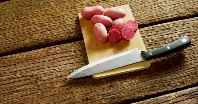 Raw Red Potatoes on Wooden Cutting Board with Knife - Download Free Stock Images Pikwizard.com