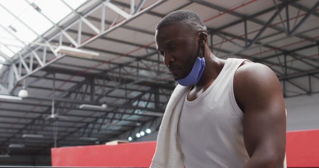 Focused athlete taking break in indoor sports facility - Download Free Stock Images Pikwizard.com