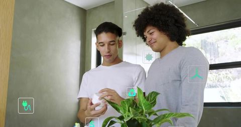 Two men exploring smart home device in sunlit modern bathroom with ar icons