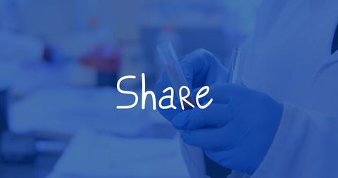 Lab technician handling test tubes in lab environment