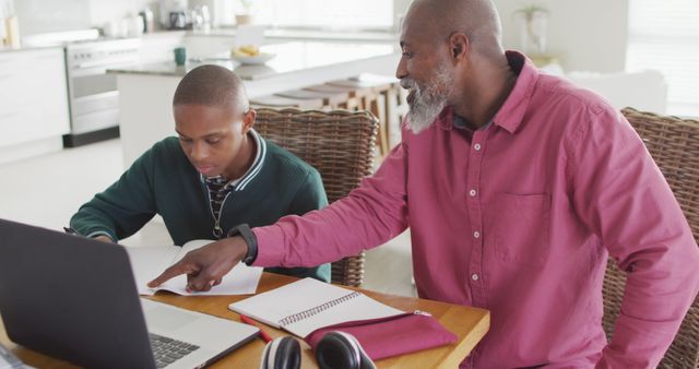 Father Helping Son with Homework in Home Kitchen - Download Free Stock Images Pikwizard.com