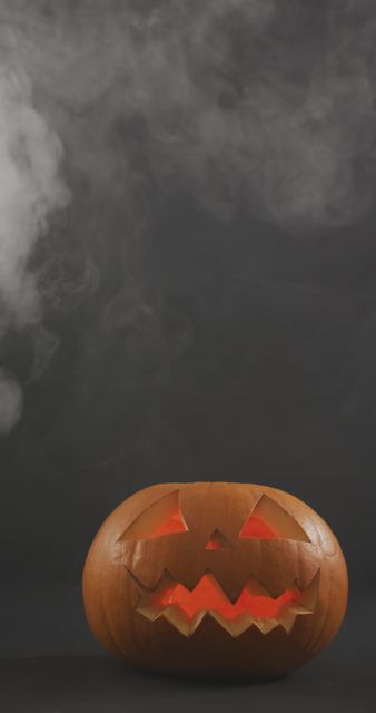 Glowing Jack-O'-Lantern with Rising Smoke for Halloween Celebration - Download Free Stock Images Pikwizard.com