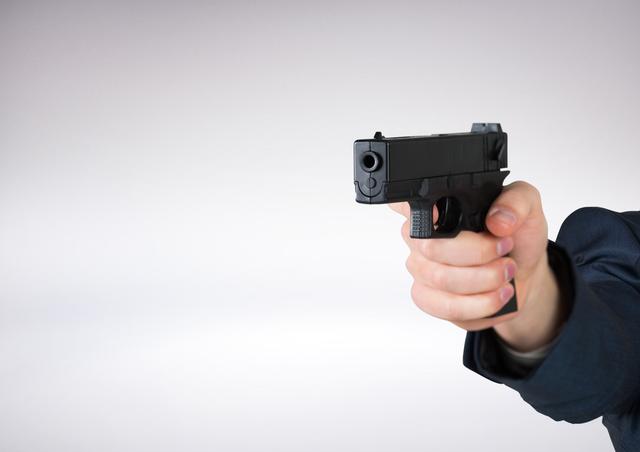 Digital composite of Hand holding gun with white background