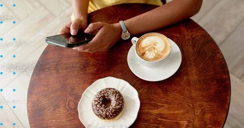 Casual Coffee Shop Moment with Latte Art and Donut