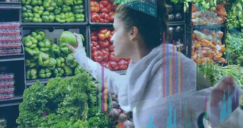 Shopper Choosing Green Bell Pepper in Vibrant Produce Section