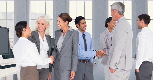 Business executives shaking hands during office meeting, suitable for themes related to collaboration, teamwork, successful partnerships, professional engagements, and business communication in corporate environments. Ideal for use in business presentations, corporate websites, and articles on business etiquette.