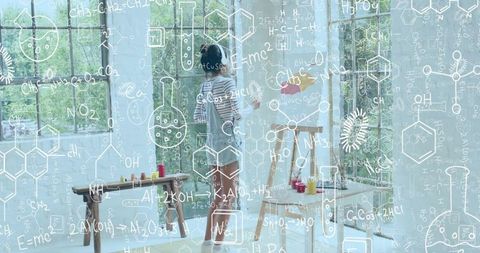 Artist painting at easel in bright studio with chemistry formula overlay and natural light