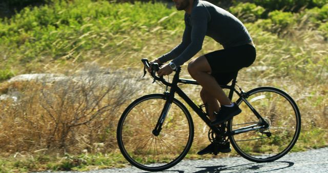 Cyclist riding bike on sunny day outdoors - Download Free Stock Images Pikwizard.com