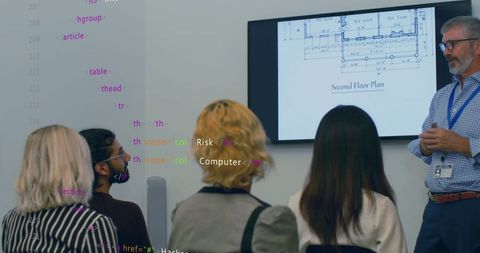 Diverse Business Team Discussing Strategic Plans in High-Tech Office