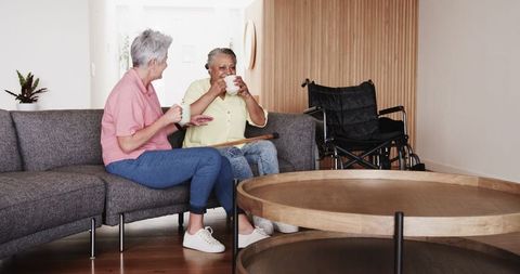 Senior Lesbian Couple Enjoying Coffee at Home