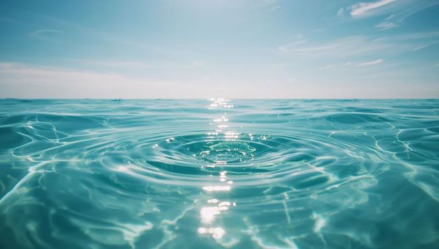 Serene ocean ripple with sunlight reflections