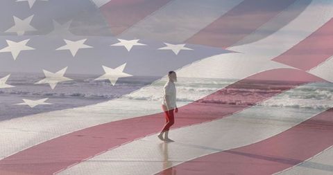 American flag overlay senior man walking on beach