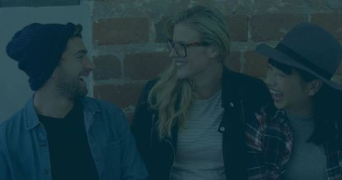Multicultural friends enjoying laughter in trendy loft
