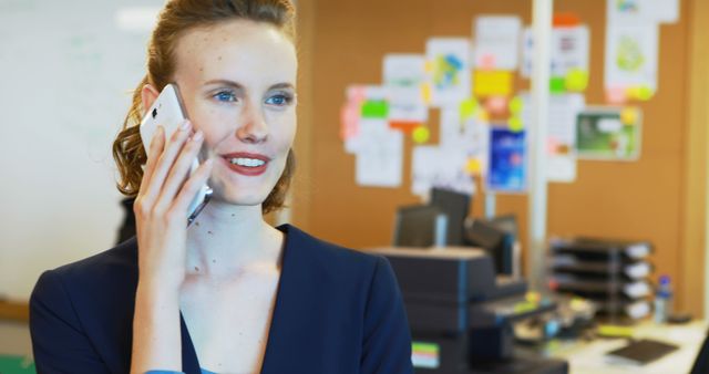 Businesswoman Discussing on Smartphone in Modern Office - Download Free Stock Images Pikwizard.com