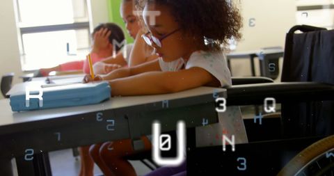 Inclusive education concept with wheelchair user writing in classroom