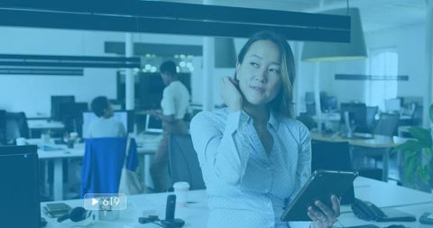 Professional Woman with Tablet in Contemporary Office Setting
