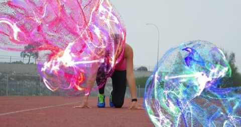 Crouching Athlete with Vibrant Energy Orbs Racing Forward