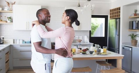 Loving Couple Embracing During Breakfast Time in Modern Kitchen - Download Free Stock Images Pikwizard.com