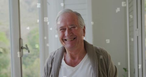 Smiling senior relaxing at home with numeric graphics