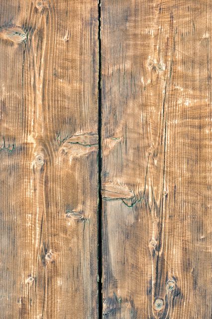 This detailed image of a rustic wooden plank with natural knots and grain texture is ideal for use in creating backgrounds, textures for graphic design projects, or adding a vintage feel to digital artwork. Perfect for web designers, graphic designers, and interior decor visuals. The intricate details of the wood grain and imperfections make it suitable for use in ads, social media posts, or even as wallpaper or flooring visualization in architectural projects.