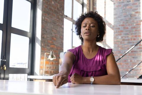 Confident professional woman engaged in workplace task