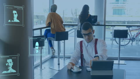 Doctor Using Laptop with Digital Interface in Modern Cafe