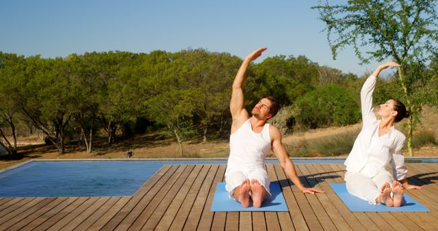Couple Practicing Outdoor Yoga by Pool Deck on a Sunny Day - Download Free Stock Images Pikwizard.com