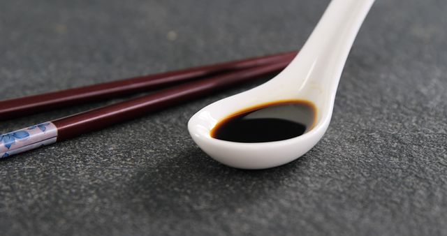 Soy Sauce in Ceramic Spoon with Wooden Chopsticks on Slate Surface - Download Free Stock Images Pikwizard.com