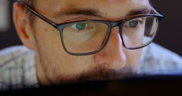 Focused Man with Glasses Working on Computer - Download Free Stock Images Pikwizard.com