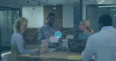 Business Team Analyzing Digital Networks in Modern Office