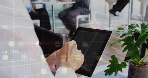 Business Analysis with Tablet in Modern Office Environment