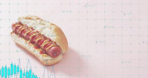 Hot dog resting on pastel pink grid with teal chart overlay minimalist food data concept